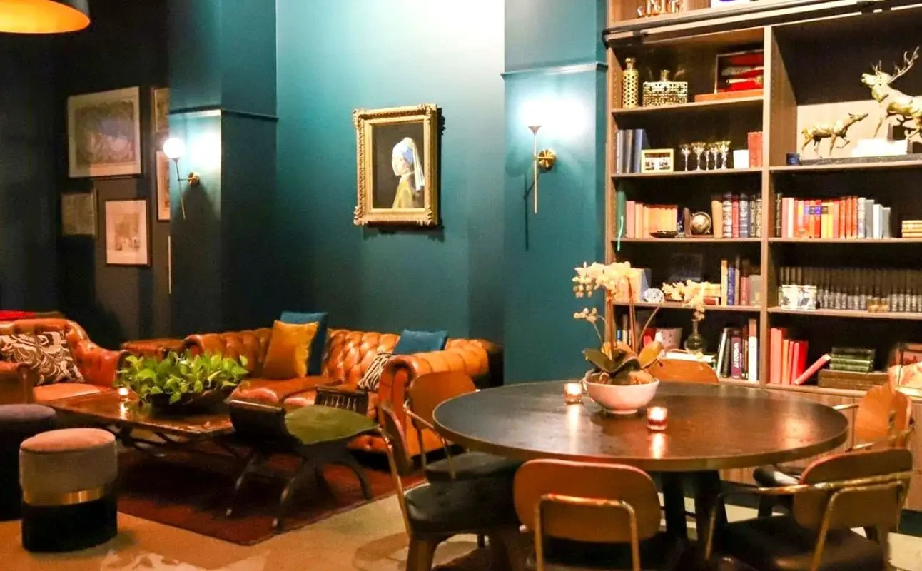 Mysterious candlelit interior of Mystery Manor Experience